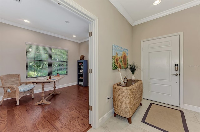 entryway featuring crown molding and light hardwood / wood-style flooring