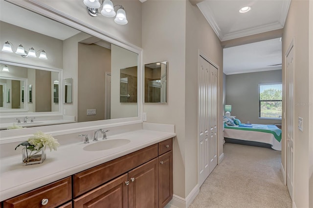 bathroom with crown molding and vanity