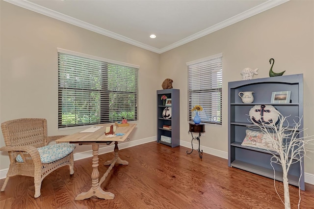 sitting room featuring wood-type flooring and ornamental molding