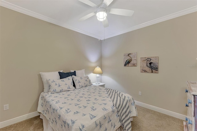 carpeted bedroom featuring ceiling fan and crown molding