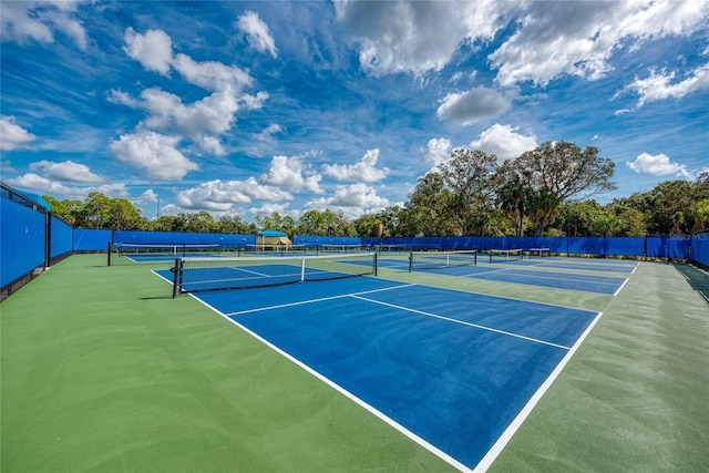 view of tennis court featuring basketball court