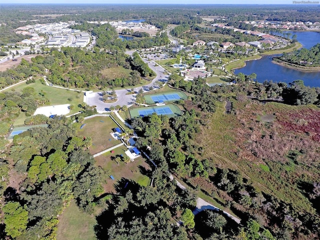 birds eye view of property with a water view