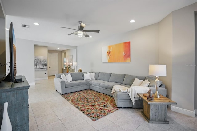 living room featuring tile floors and ceiling fan