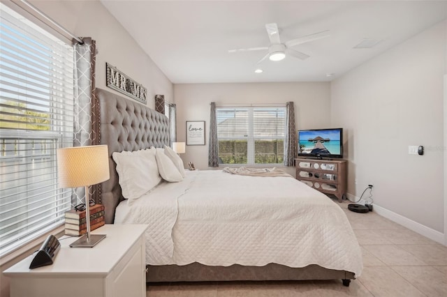 bedroom featuring ceiling fan and light tile floors