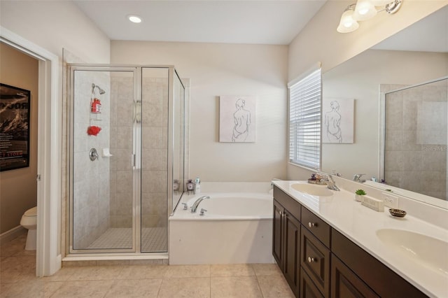 full bathroom with tile flooring, shower with separate bathtub, toilet, oversized vanity, and dual sinks