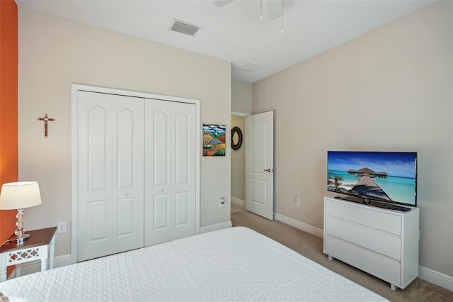 bedroom featuring a closet, carpet, and ceiling fan