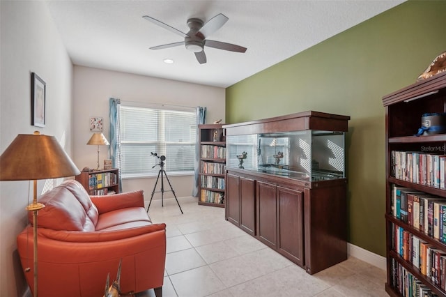 tiled living room with ceiling fan