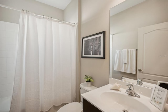 bathroom featuring toilet and large vanity