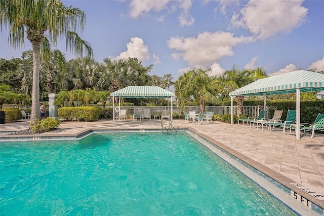 view of swimming pool featuring a patio area