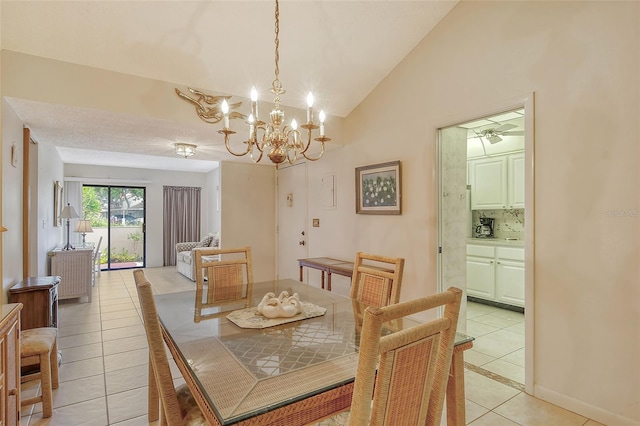 tiled dining room featuring vaulted ceiling and a notable chandelier