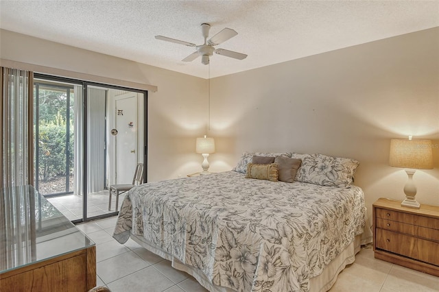 tiled bedroom with a textured ceiling, access to outside, and ceiling fan