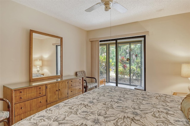 bedroom featuring access to exterior, ceiling fan, and a textured ceiling