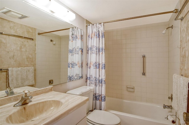 full bathroom with vanity, shower / tub combo, and toilet