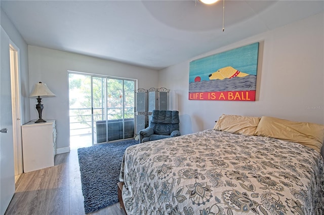 bedroom featuring wood finished floors and a ceiling fan