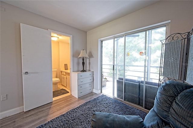 sitting room with wood finished floors and baseboards