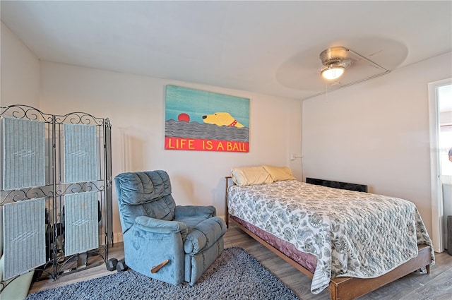 bedroom featuring ceiling fan and wood finished floors