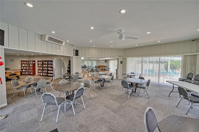 dining room featuring a textured ceiling, ceiling fan, carpet, and recessed lighting