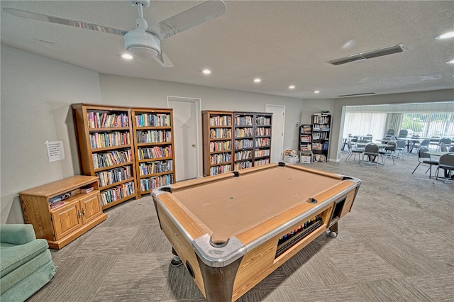 game room featuring recessed lighting, light carpet, visible vents, and a textured ceiling