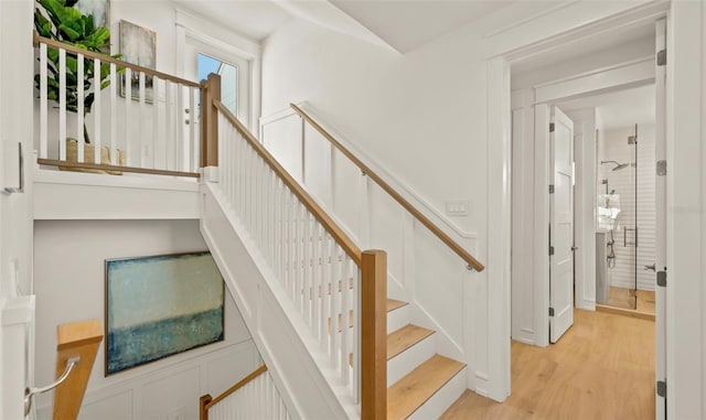 stairs with hardwood / wood-style flooring