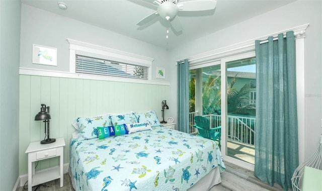 bedroom featuring ceiling fan, light hardwood / wood-style floors, and access to outside