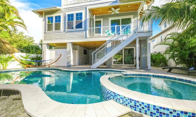 rear view of property featuring ceiling fan