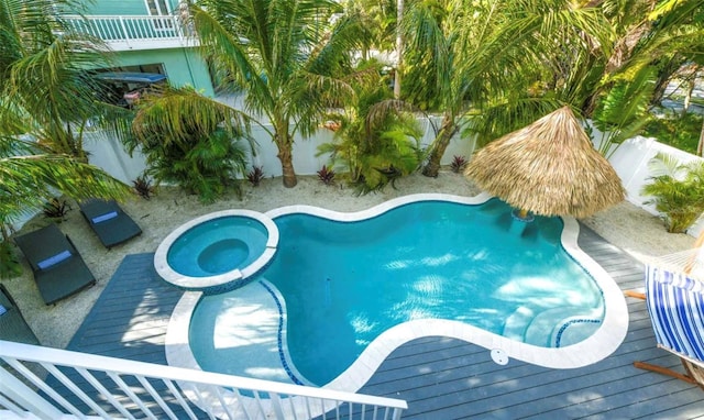 view of pool with an in ground hot tub