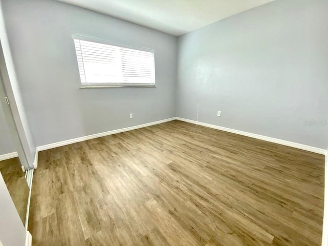 empty room featuring hardwood / wood-style floors