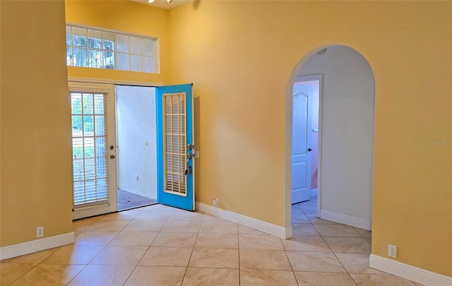 foyer entrance featuring light tile patterned floors