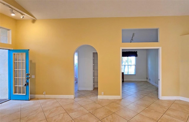 unfurnished room featuring light tile patterned flooring