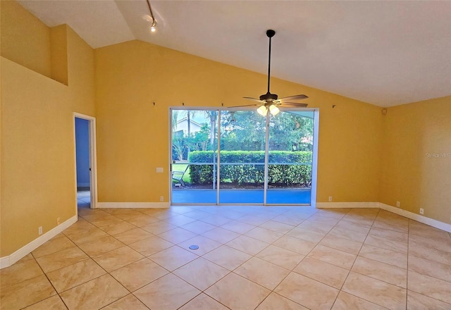 tiled empty room featuring ceiling fan and lofted ceiling