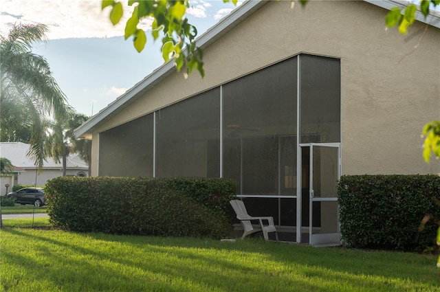 view of home's exterior with a lawn