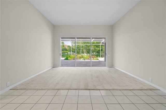 spare room with light colored carpet