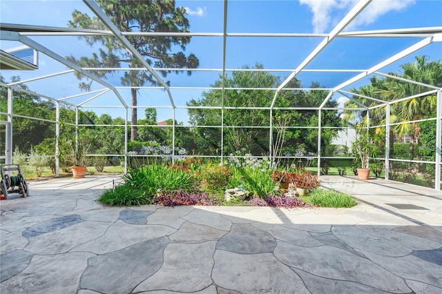 view of patio featuring a lanai