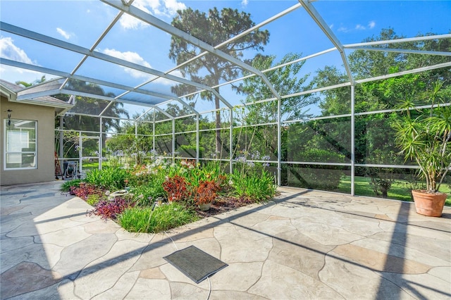 view of patio / terrace featuring glass enclosure