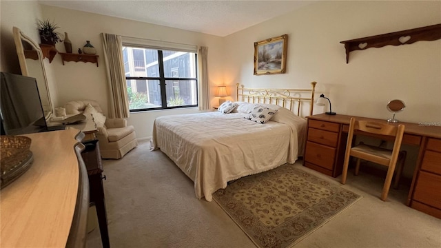 carpeted bedroom featuring a textured ceiling