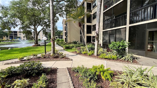 view of home's community featuring a water view