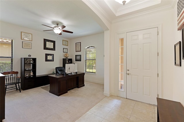 office space featuring crown molding, ceiling fan, plenty of natural light, and light colored carpet