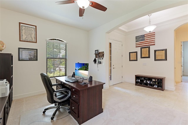 carpeted office with ceiling fan and crown molding