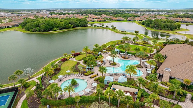 birds eye view of property with a water view