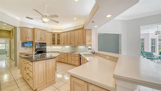 7430 Weeping Willow Dr, Sarasota, FL 34241 - kitchen with a wealth of natural light, light brown cabinets, a sink, and ceiling fan