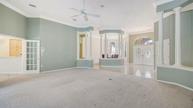 interior space with a high ceiling, french doors, light colored carpet, ceiling fan, and ornamental molding