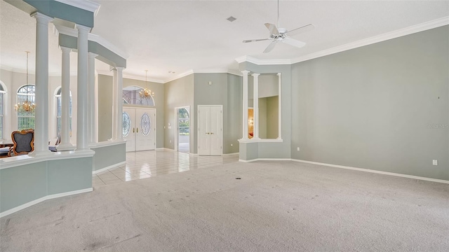 unfurnished room featuring ceiling fan with notable chandelier, ornamental molding, french doors, and light carpet