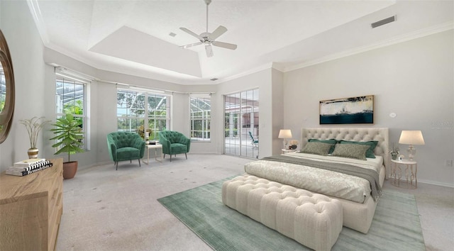 bedroom featuring a raised ceiling, light colored carpet, ceiling fan, ornamental molding, and access to exterior