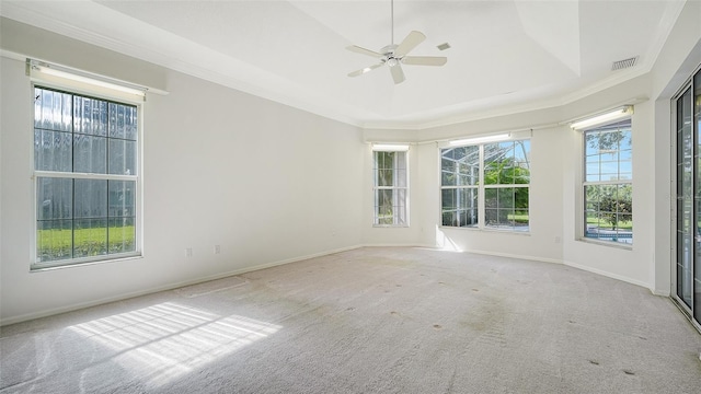 carpeted empty room featuring ceiling fan and crown molding