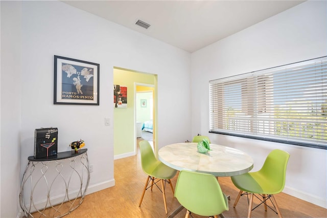 dining room with light hardwood / wood-style flooring