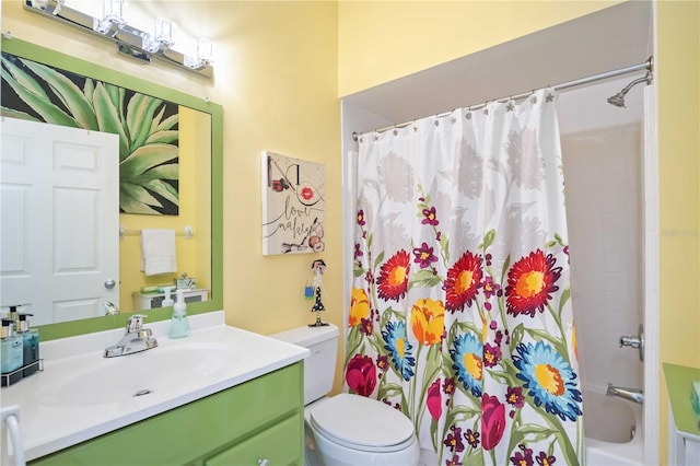 full bathroom featuring vanity, shower / bath combination with curtain, and toilet