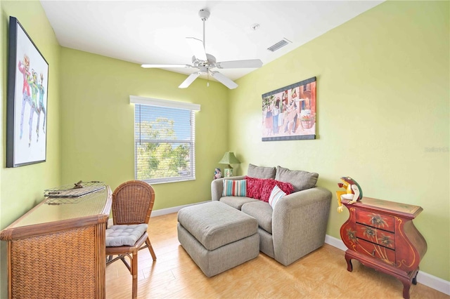 sitting room featuring ceiling fan