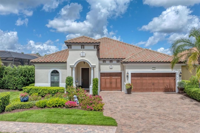 mediterranean / spanish house featuring a garage