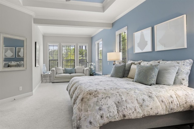 carpeted bedroom with a raised ceiling, multiple windows, and ornamental molding