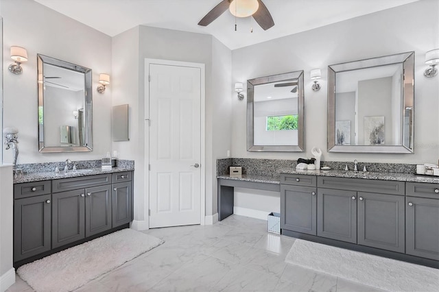 bathroom with ceiling fan and vanity